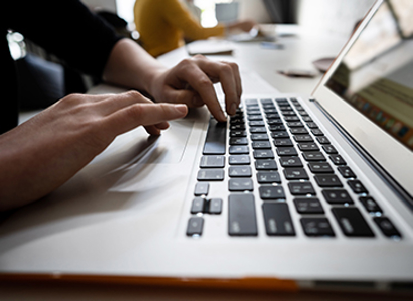 close-up-of-hands-of-businessman-typing-on-a-HM3WGAT.jpg